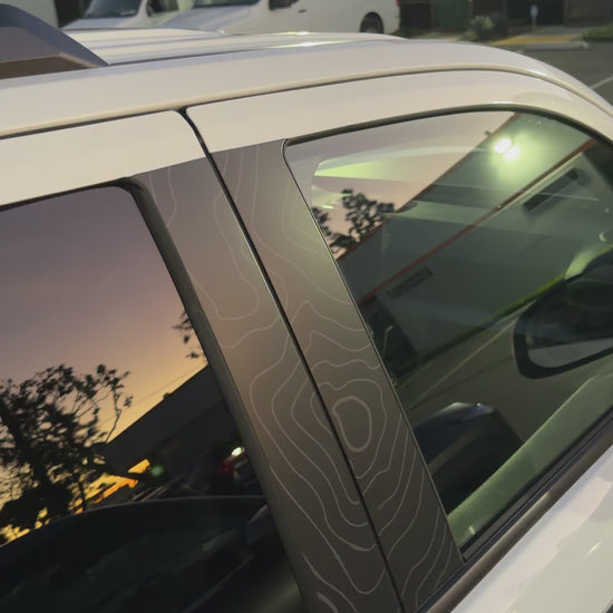 Topographic door pillar wrap installed on 6th gen Toyota 4Runner showing UV protection and custom exterior styling