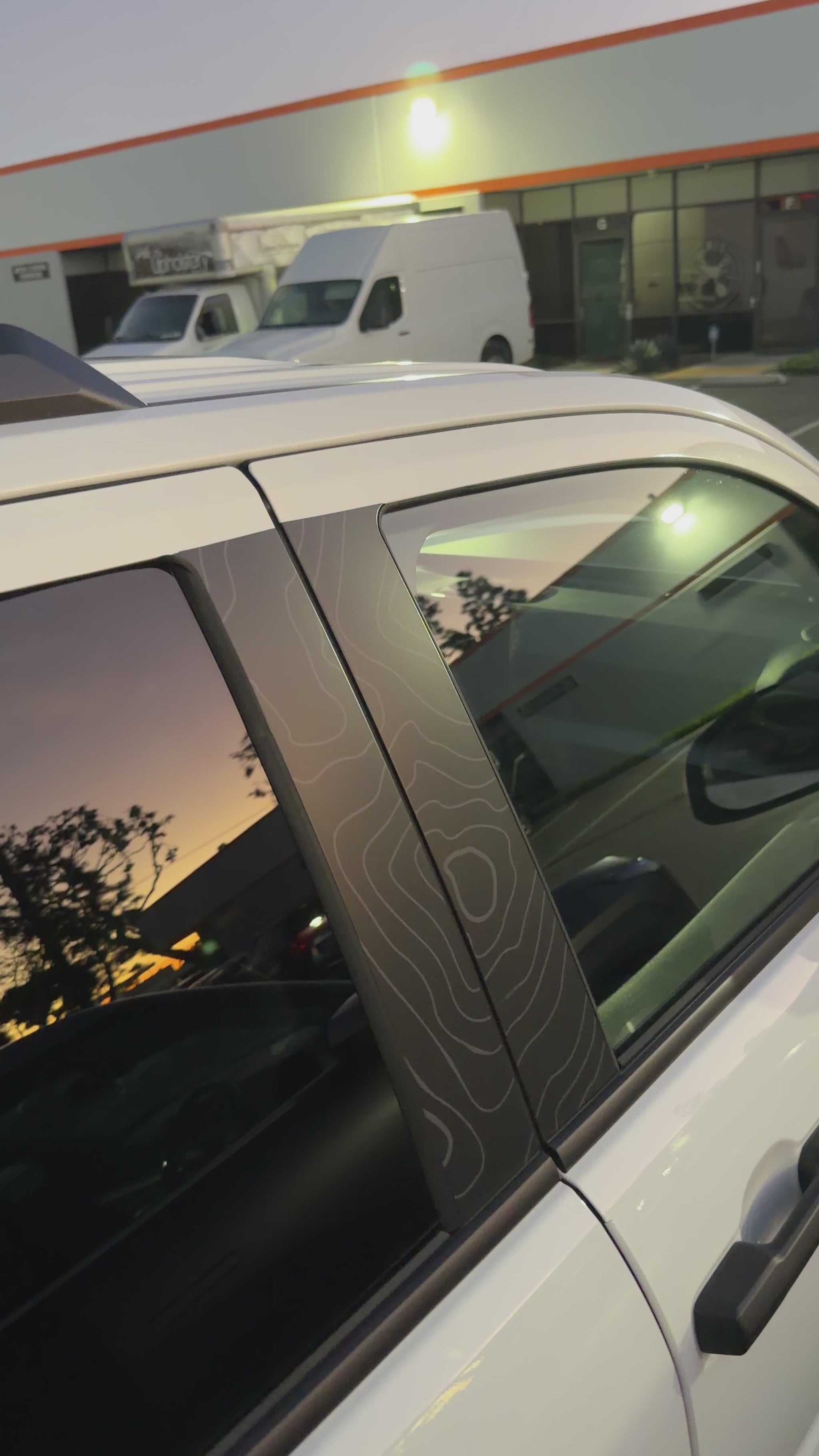 Topographic door pillar wrap installed on 6th gen Toyota 4Runner showing UV protection and custom exterior styling